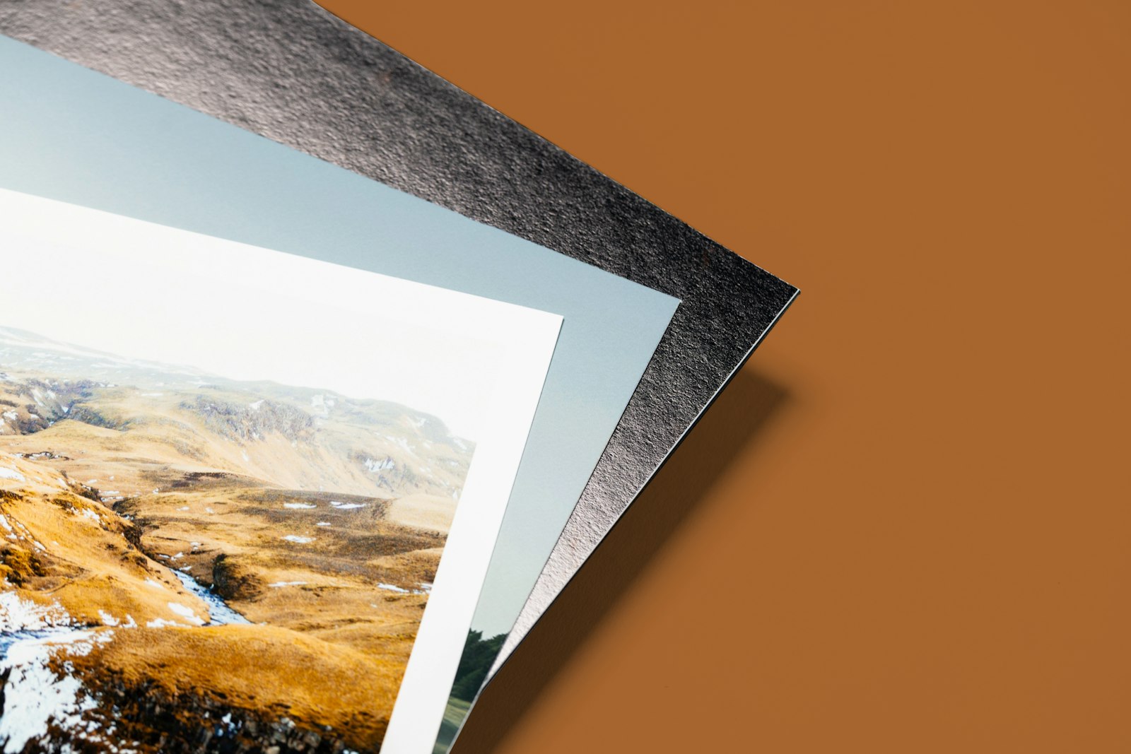 Large photographic prints styled on a table