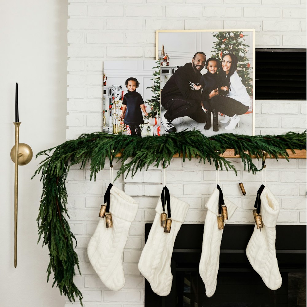 Family holiday portraits Modern Metal Framed Print & Standout on fireplace mantel with greenery