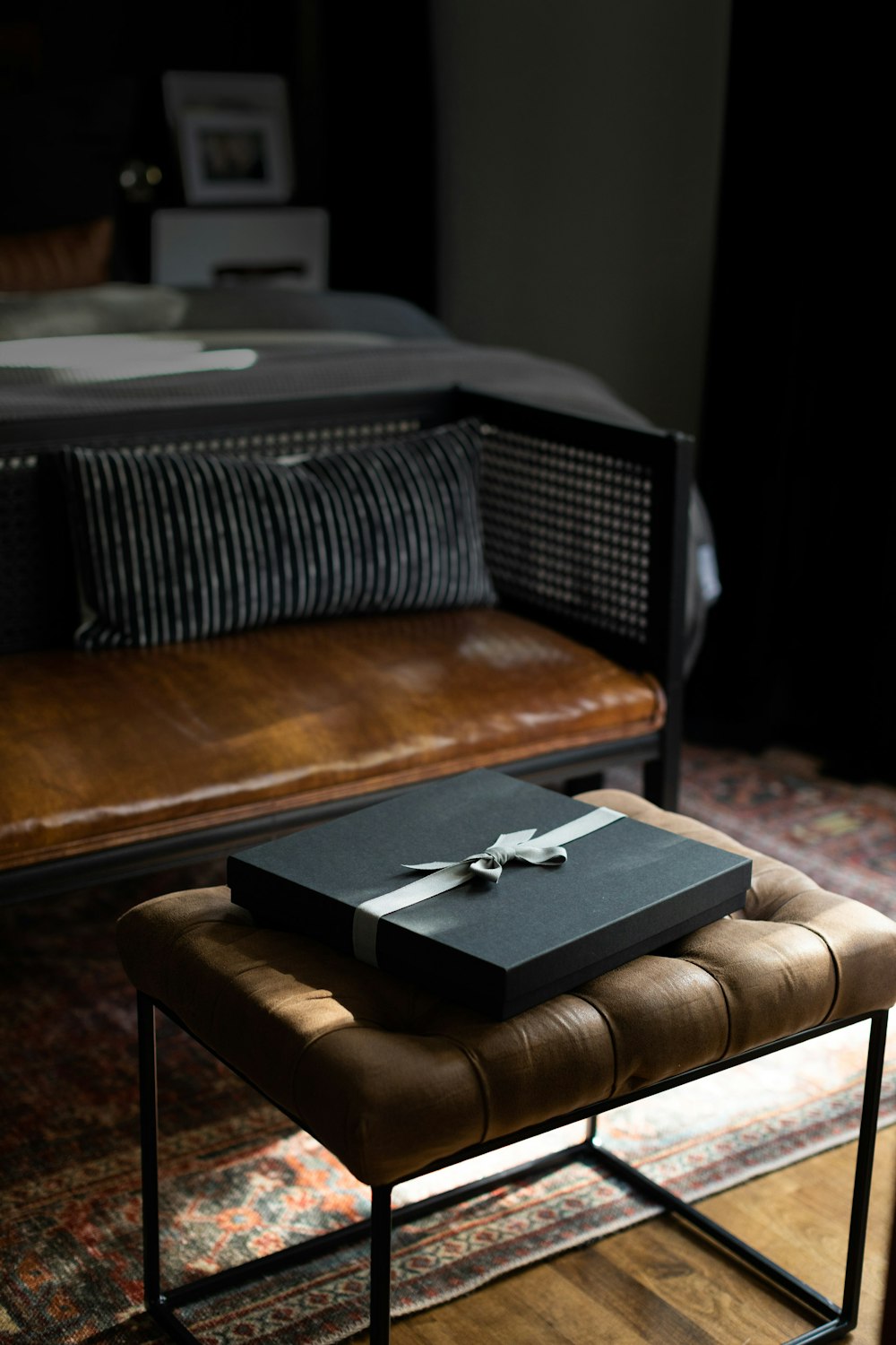 Charcoal Premium Packaging on Tufted Bench in bedroom