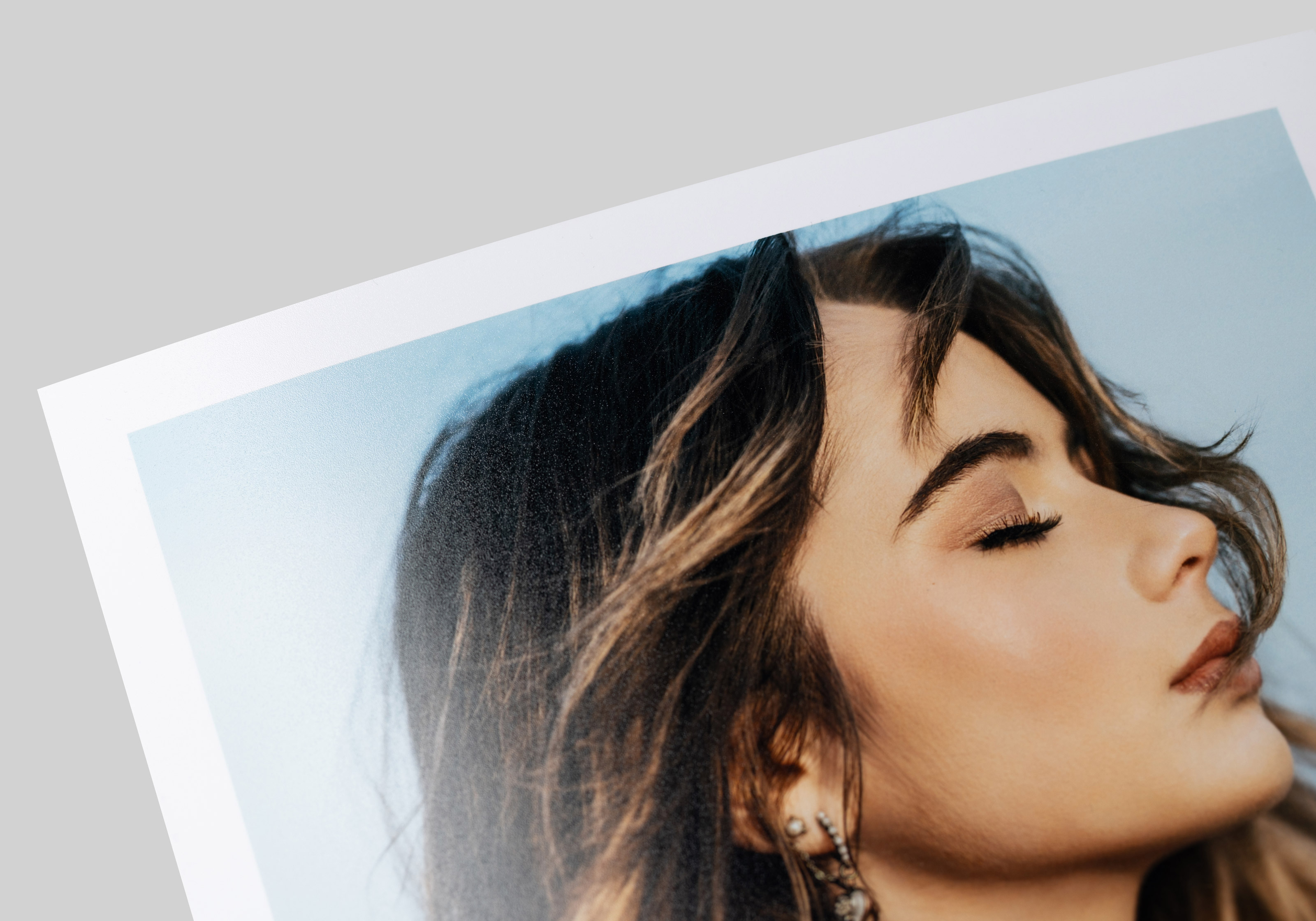 Close-up of a portrait printed on Photo Luster paper, showcasing a semi-gloss finish, sharp details, and accurate color.