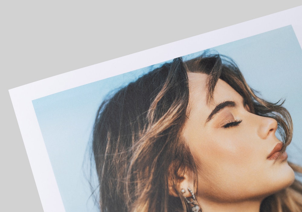 Close-up of a portrait printed on 100# weight Press Smooth Matte paper, showcasing a matte finish that feels soft to the touch.