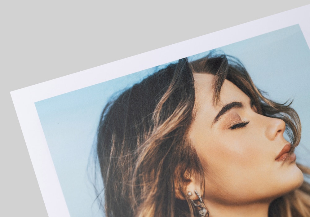 Close-up of a portrait printed on 80# weight Press Smooth Matte paper, showcasing a matte finish that feels soft to the touch.