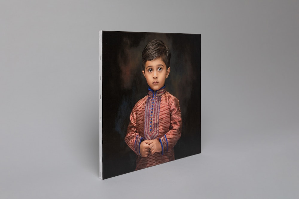 Formal, professional studio portrait of a boy printed on Portrait Canvas mounted on a Stretcher Frame, standing up on gray background
