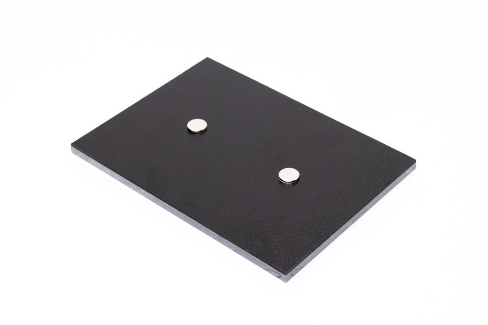 5×7 Acrylic Print lying face down on wa hite background to show two round magnets on the back for display hardware