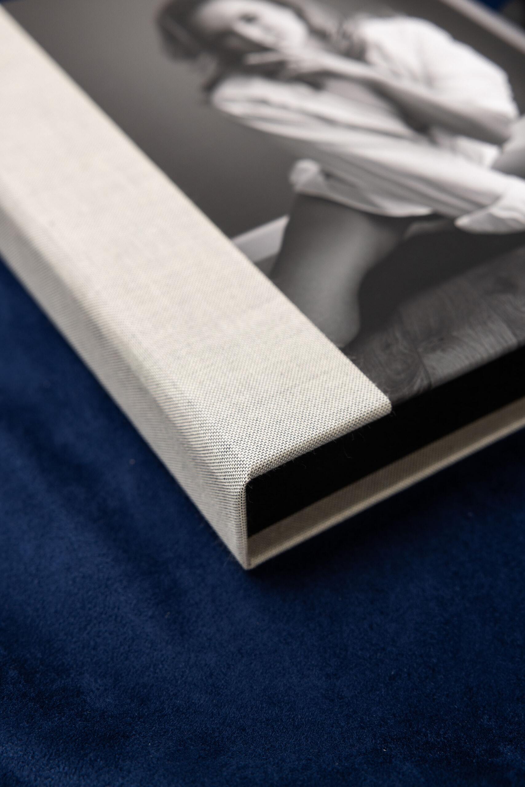Close-up of a Print Box corner showing the linen material and photo cover