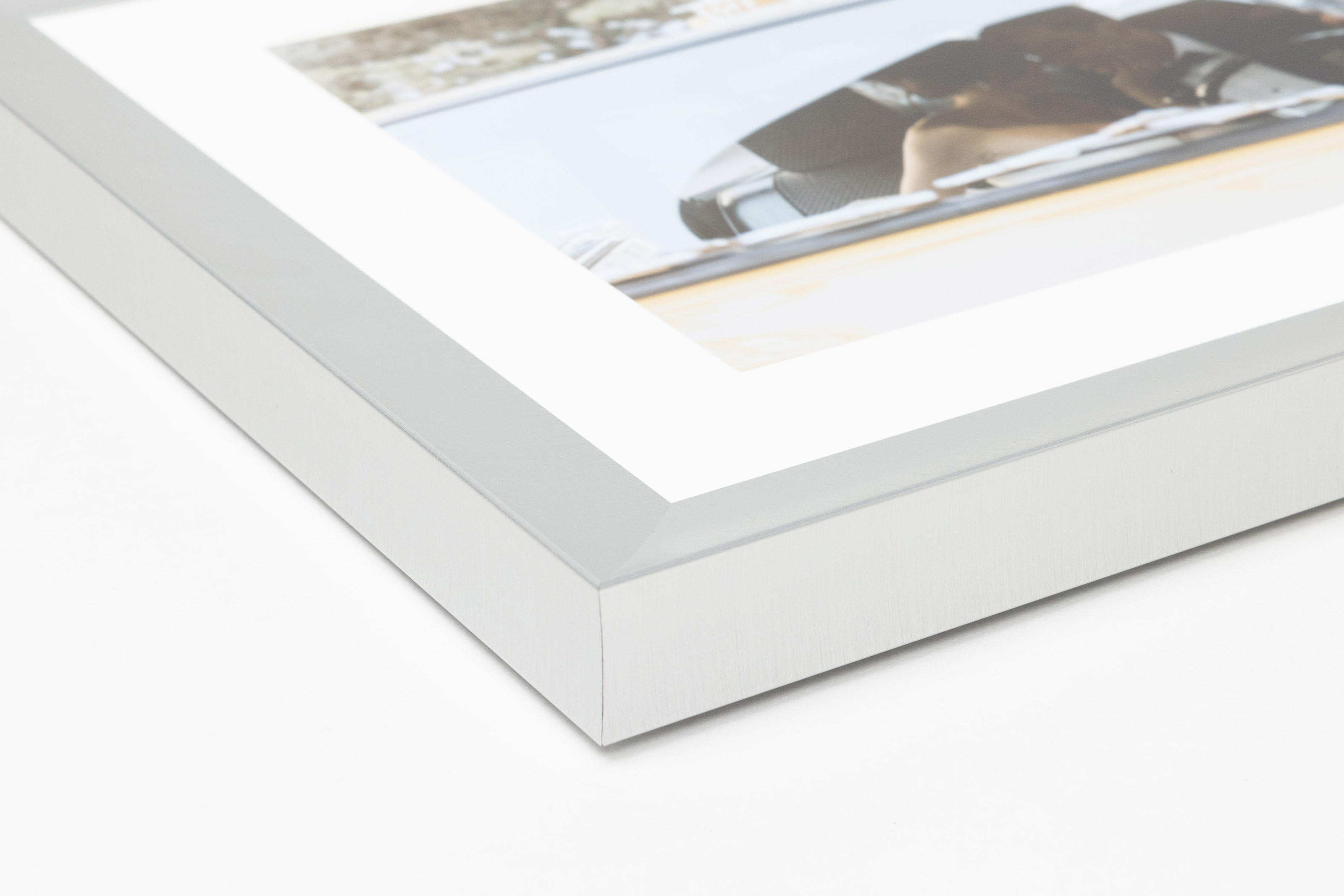 Close-up corner of a Pewter Metal Framed Print moulding on a white background