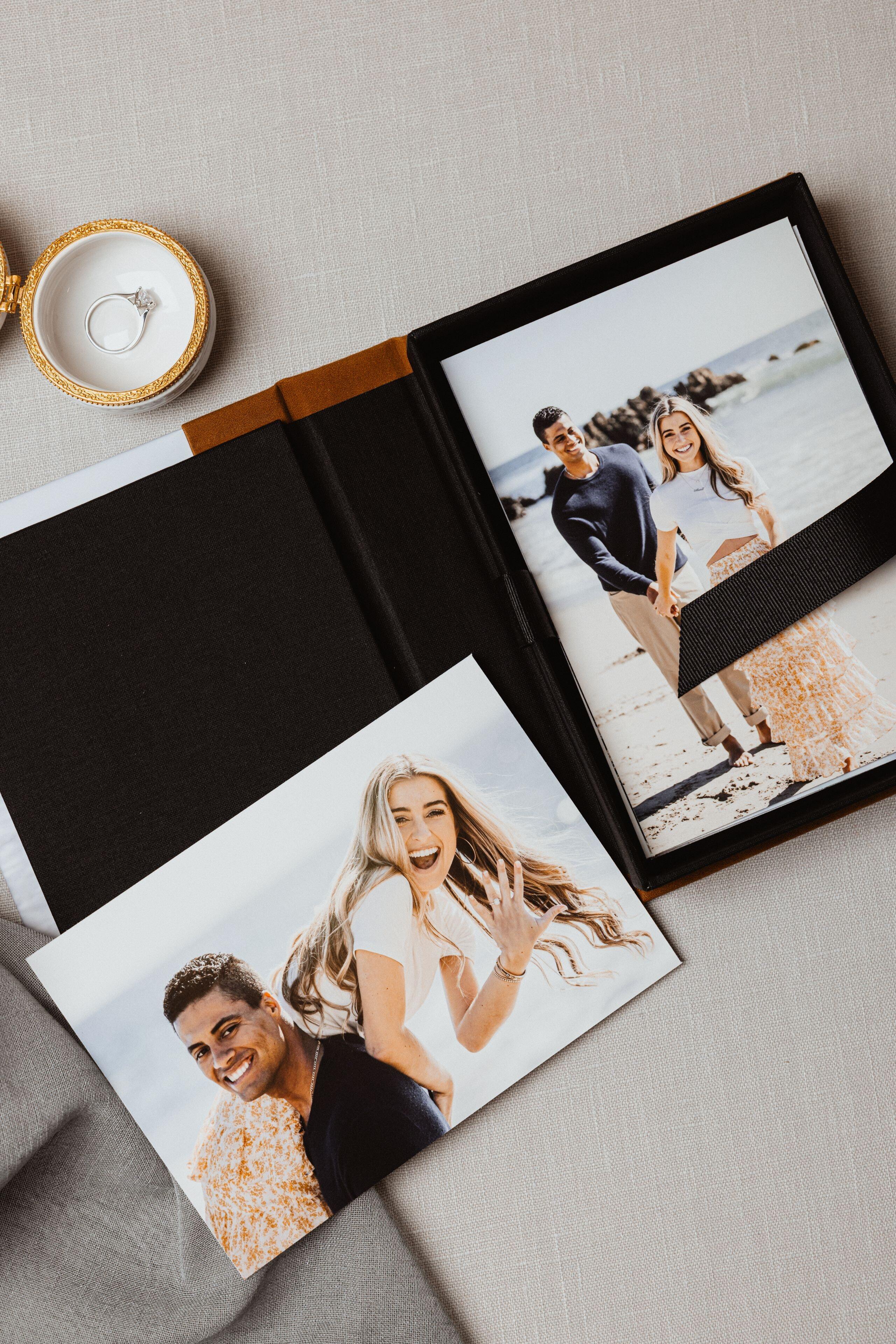 Open Print Box with loose prints of a couple, one print laid on top