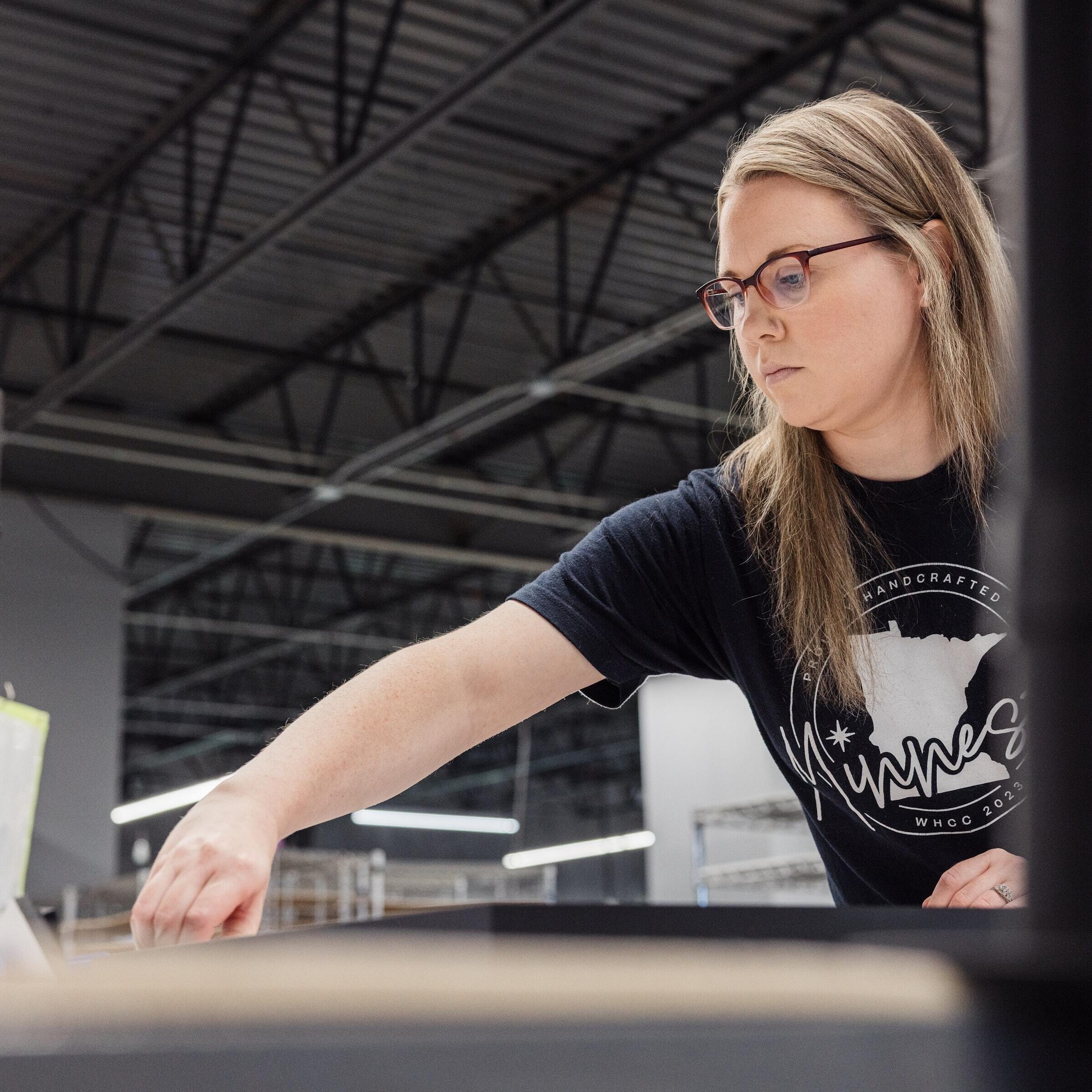 production worker assembling wall art