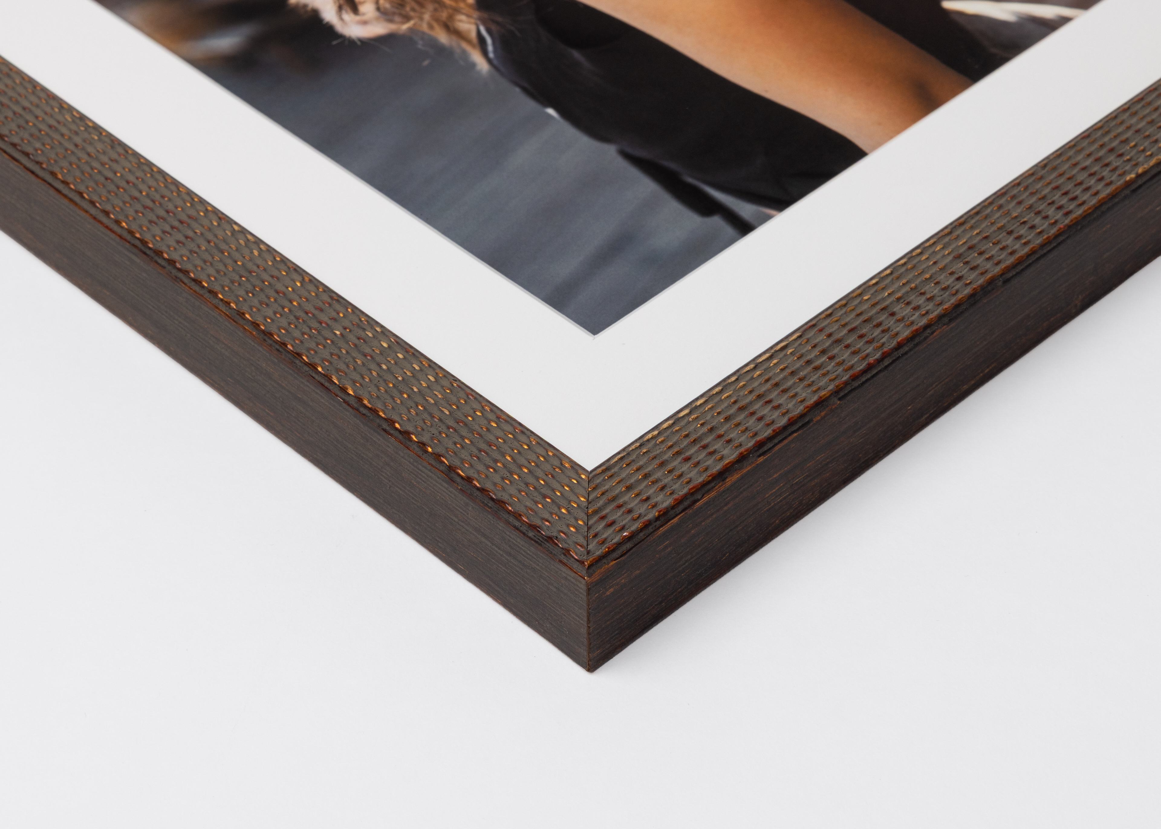 Corner detail of Antique Brown Patina Dot Frame moulding