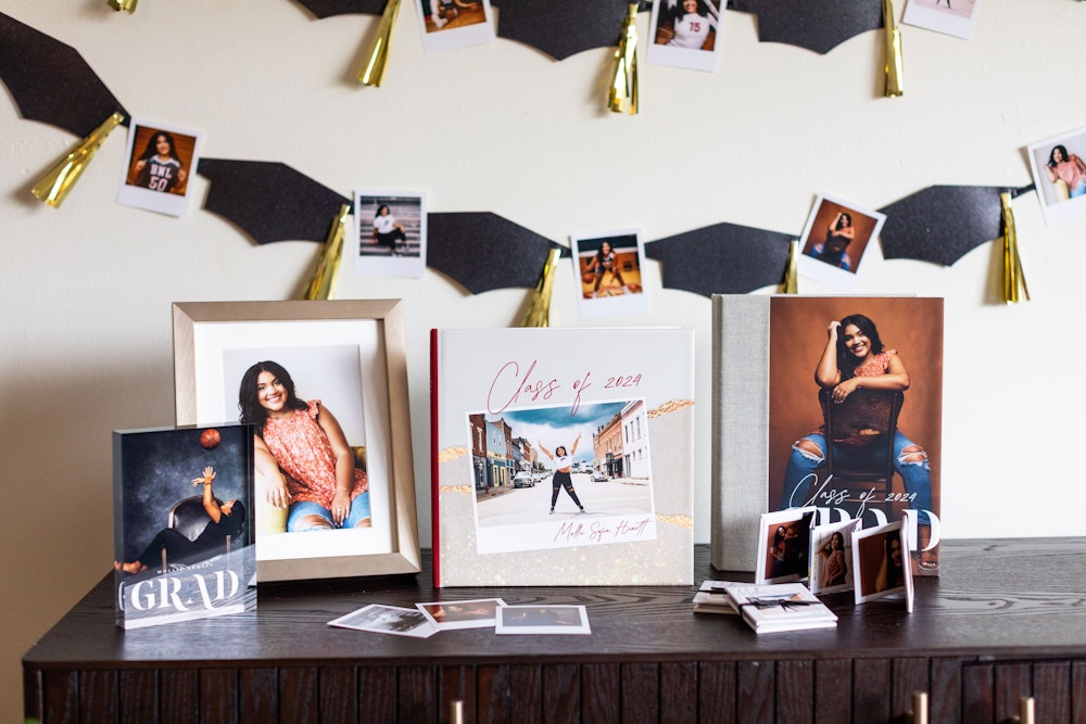 Multiple products featuring senior portraits on table with grad party decor