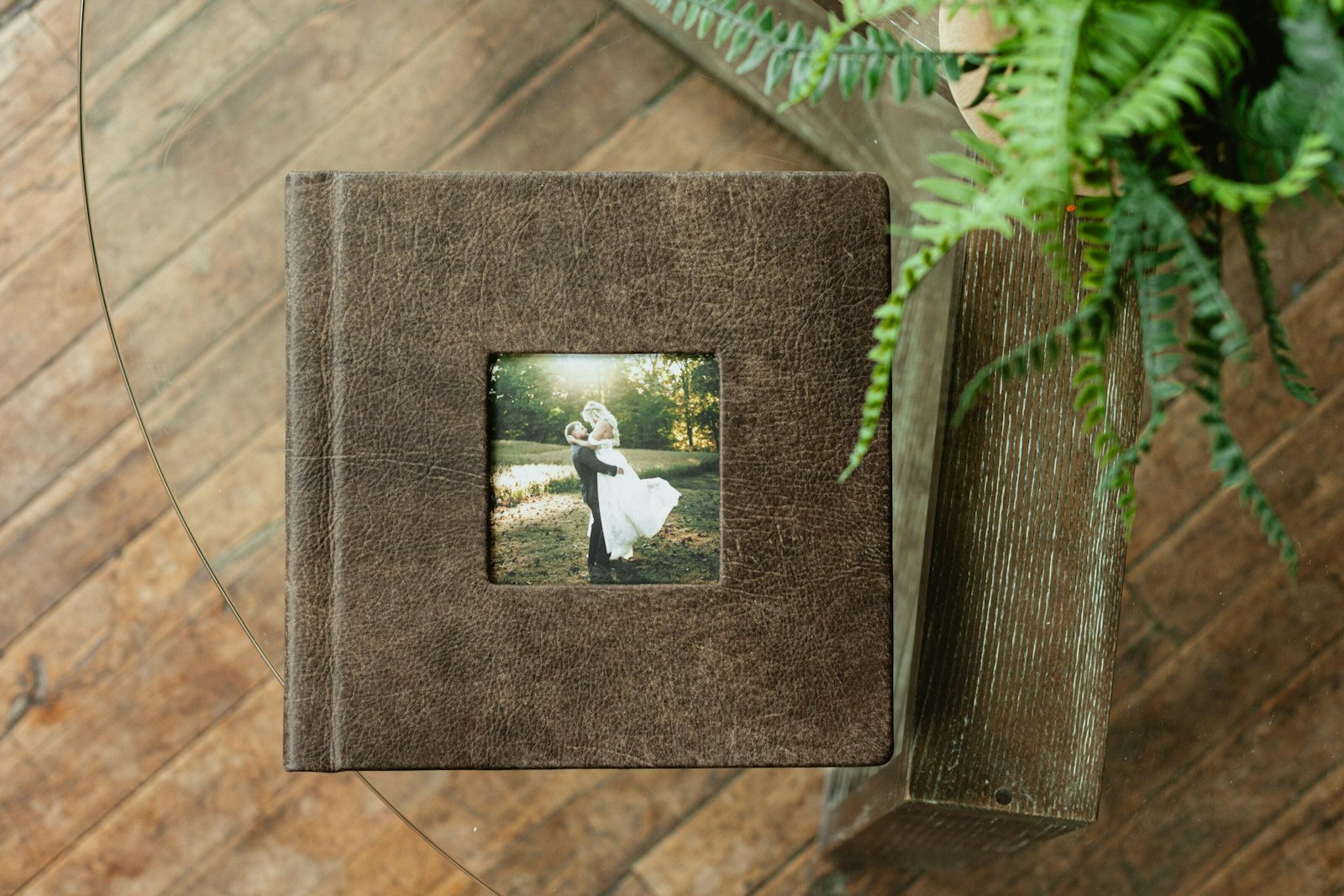 Distressed leather cameo cover with a wedding couple