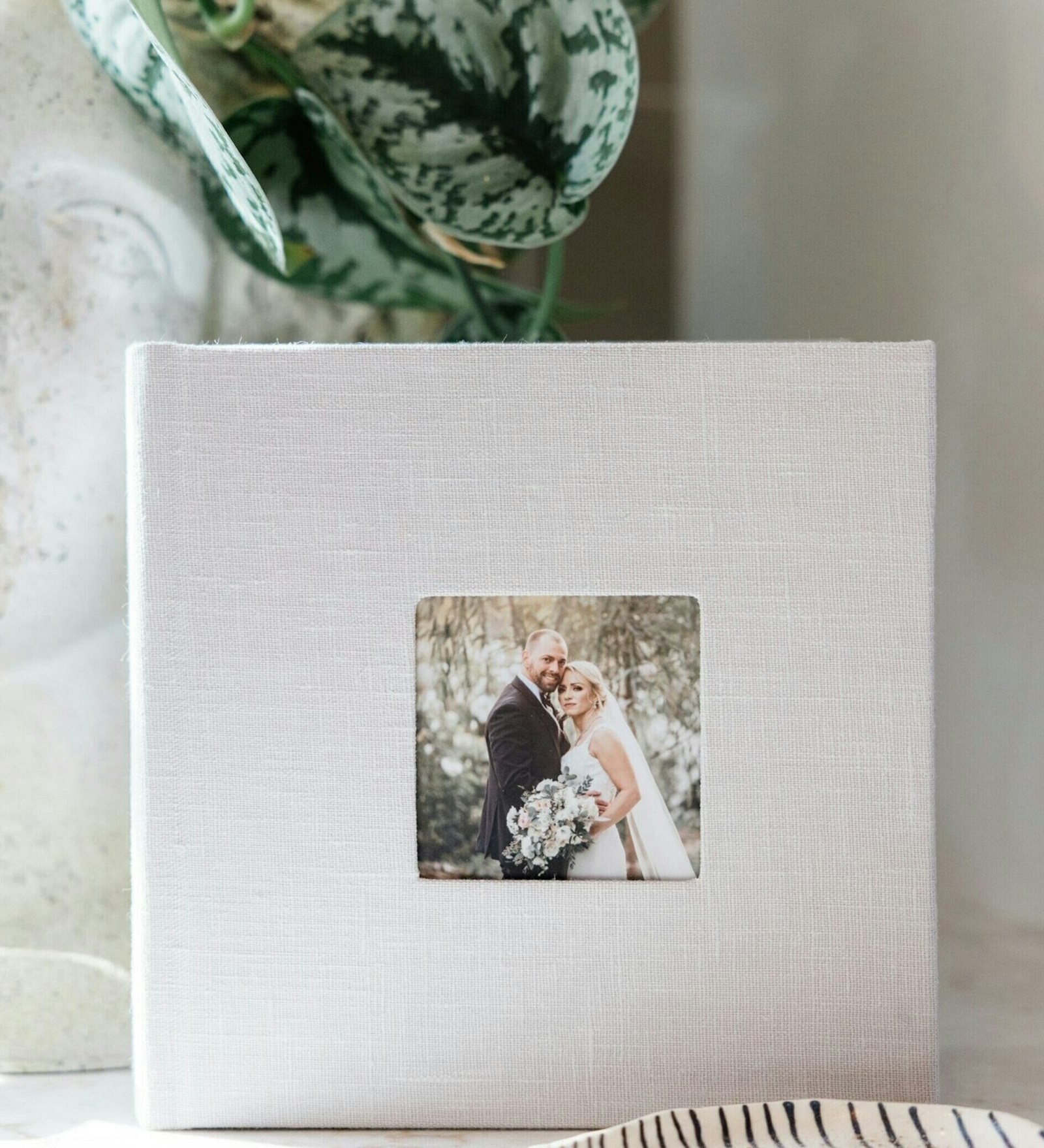 Linen cameo-cover album on a shelf