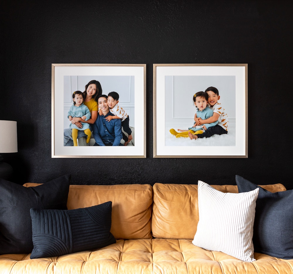 Square Matted Gramercy Prints Styled on Dark Wall Above Tan Couch