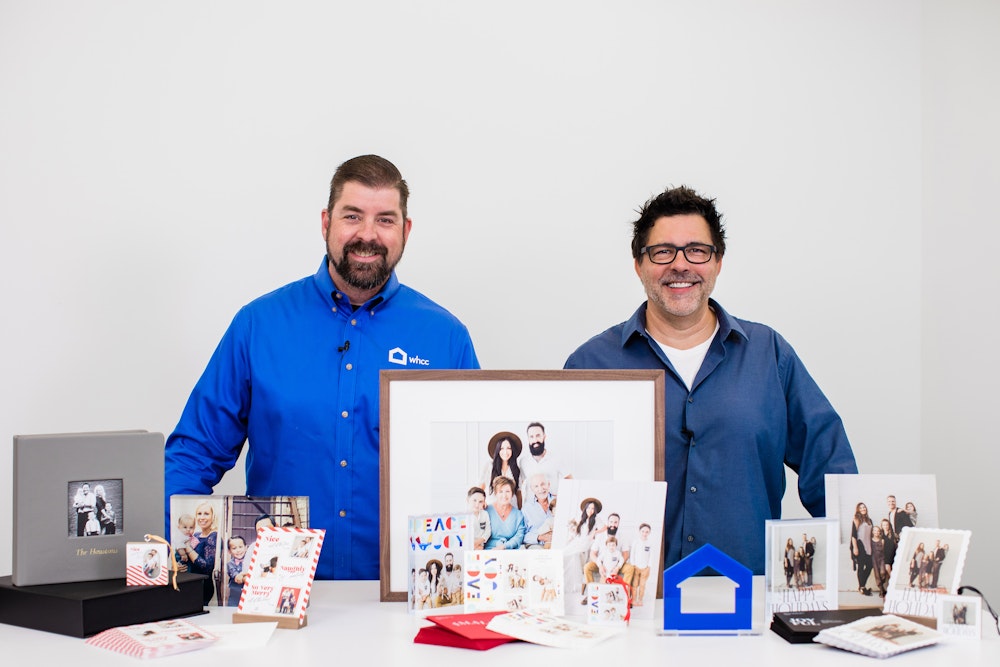 Robert & Matt behind a table full of small print products during WHCC YouTube Live