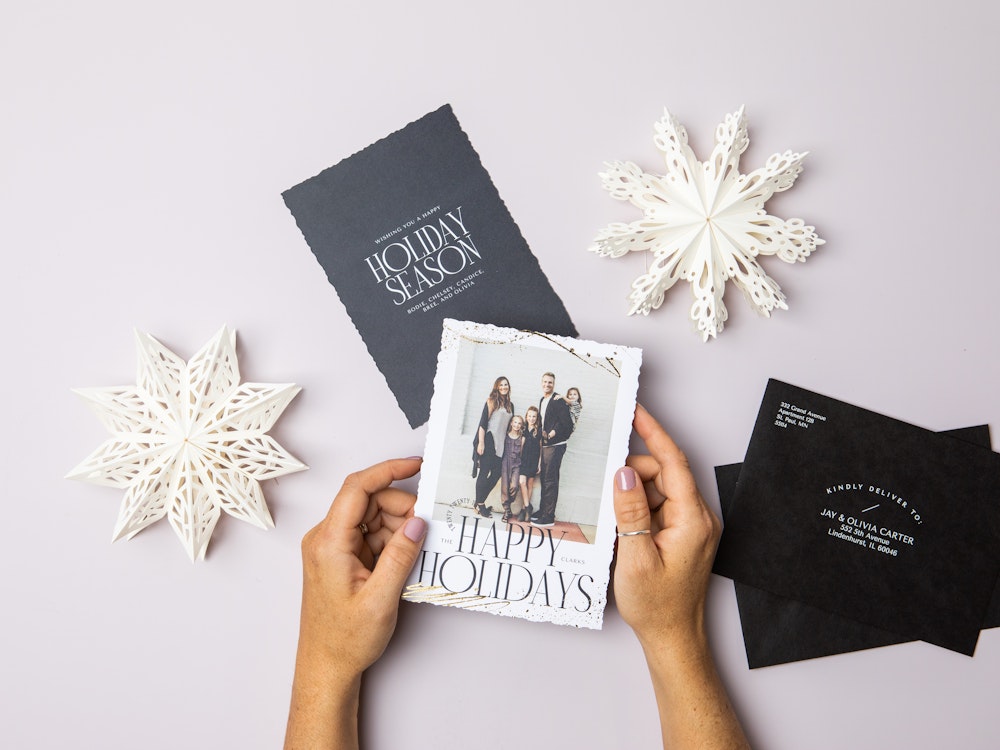 Holiday Card Flat Lay Styled Hands and envelopes