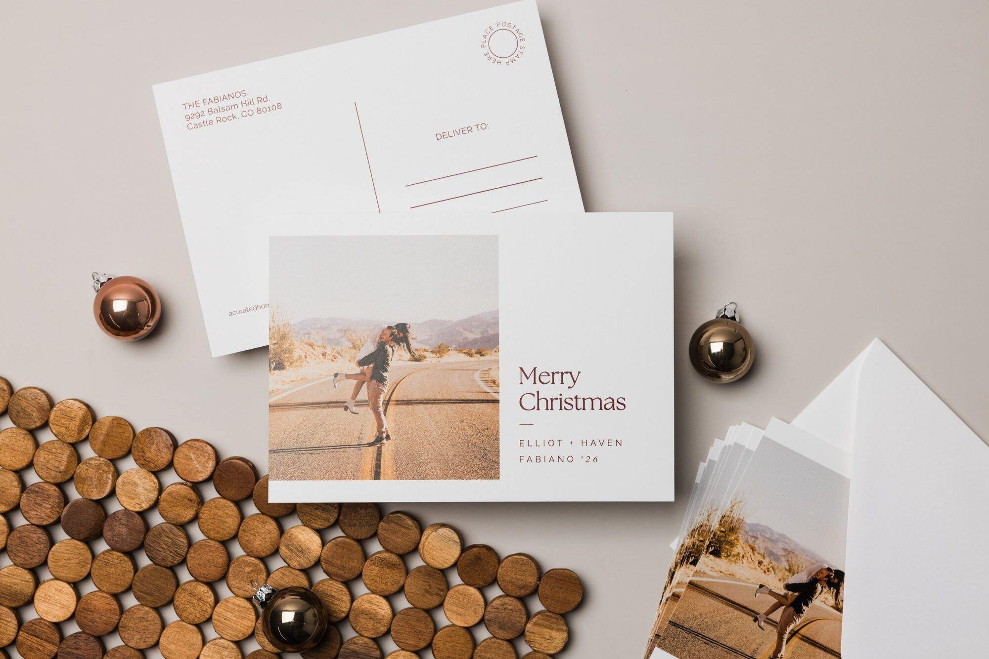 Open folded holiday card on matte paper with a family photo and a handwritten Happy Holidays message inside