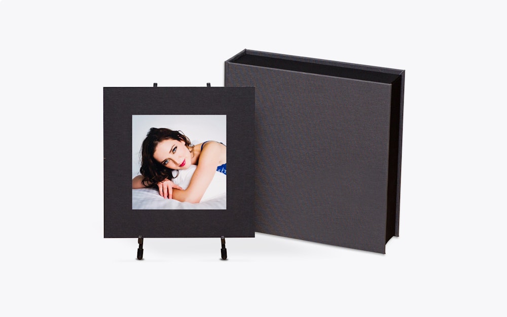 8x8 black matted boudoir print in metal easel with material cover Image Box