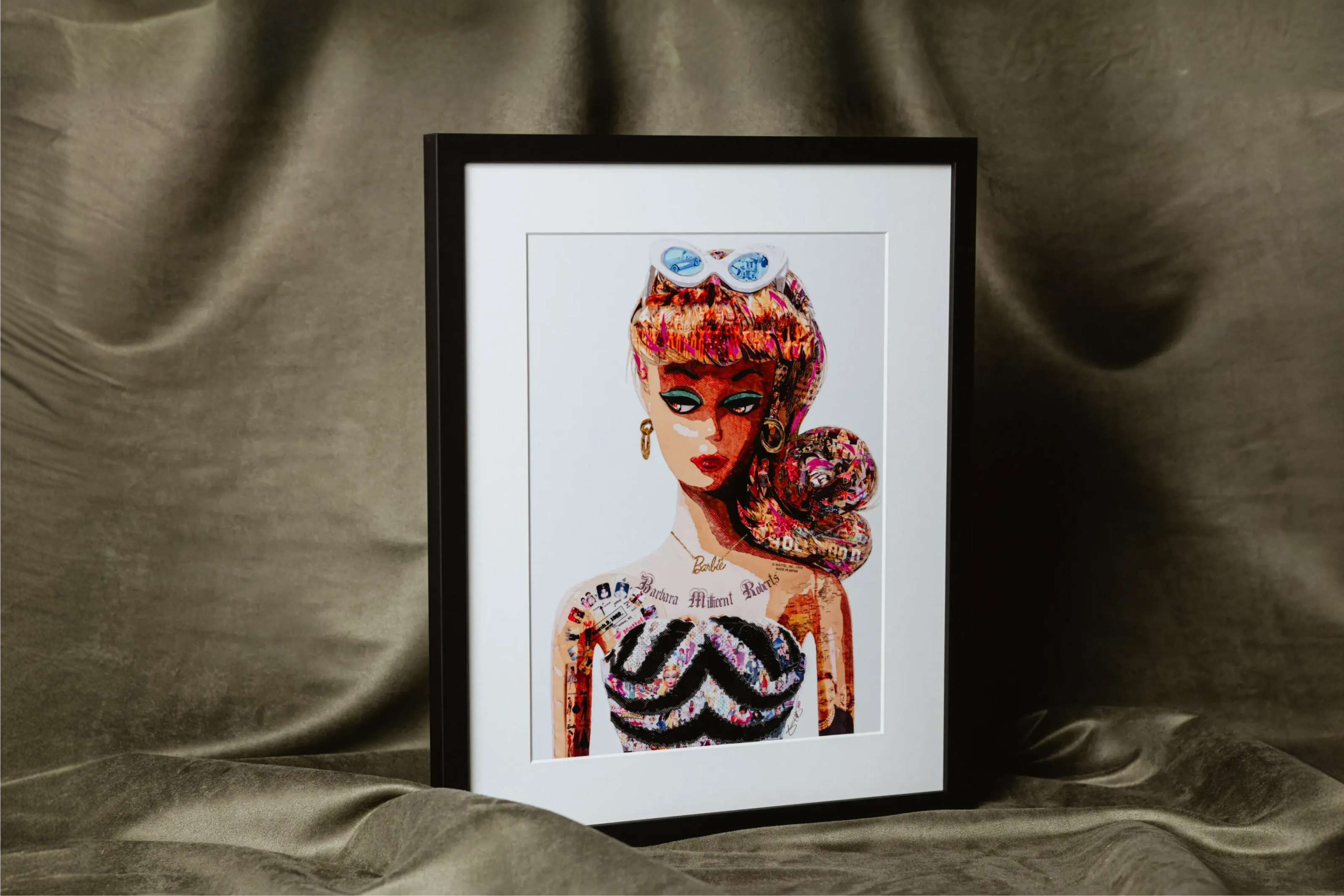 Barbie print by Kristi Abbot in a Gallery Black frame with white mat styled on olive green drapery