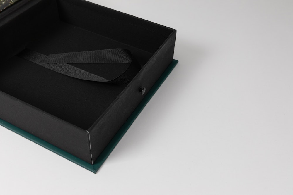 Empty open Image Box with elastic closure and ribbon detail