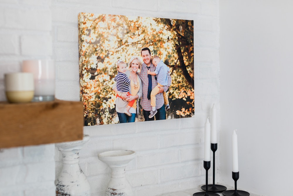 Fall family Gallery Wrap hanging on white brick living room wall