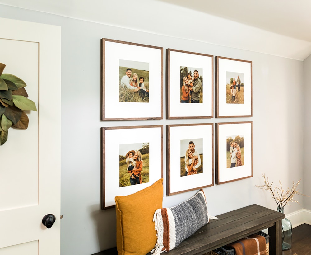 Family wall gallery of six woodland walnut frames with mats