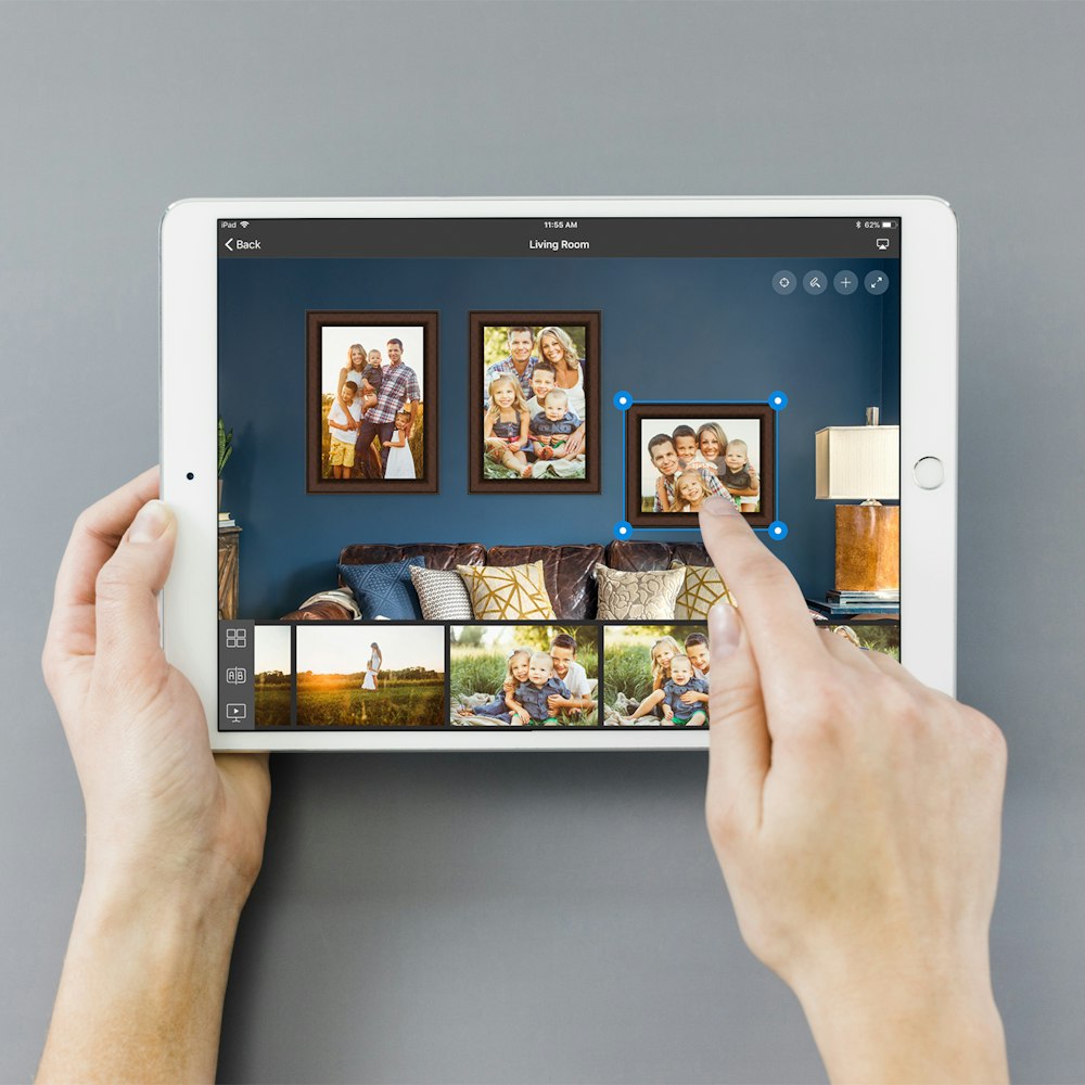 Hands creating wall collage in Studio iPad app
