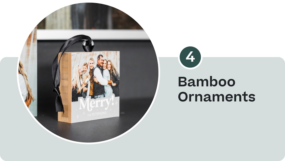 4 Bamboo Ornaments—family holiday design with black ribbon on shelf