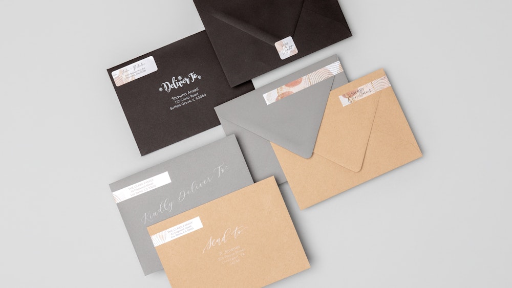 Multiple Address Label and Envelope Seal designs on black, grey, and kraft premium envelopes