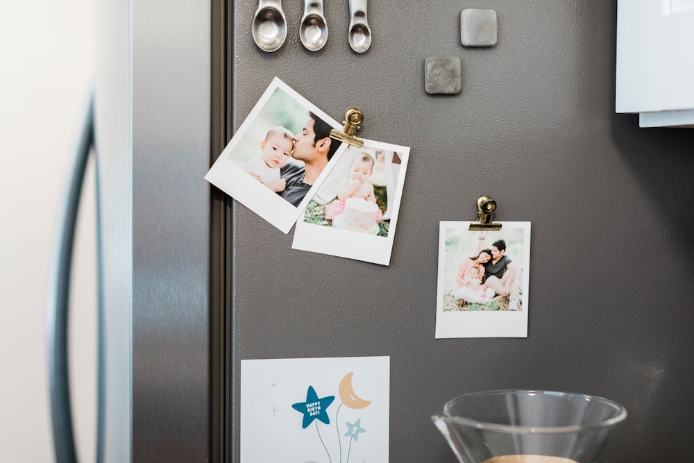 Multiple Mini Snapshots hanging on fridge