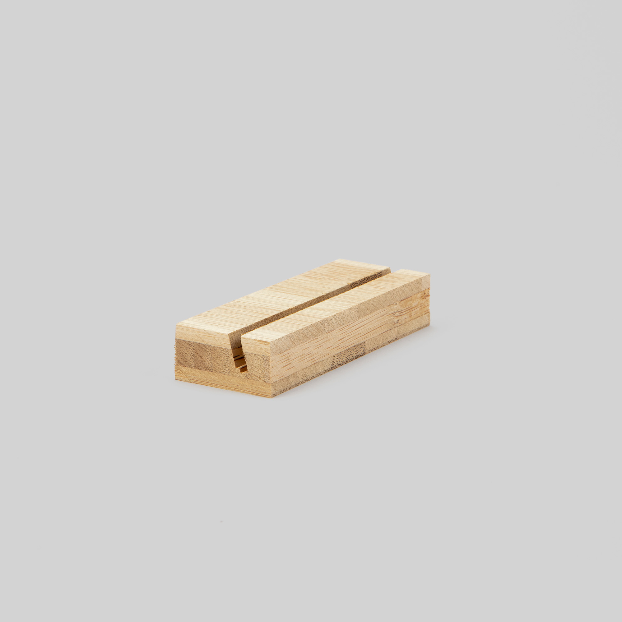 4-inch bamboo Wood Display Stand at an angle on grey background