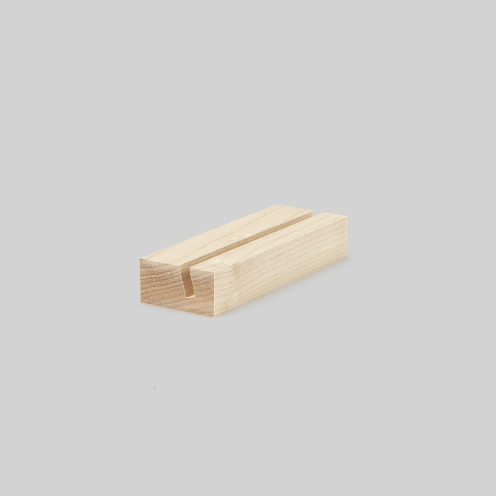 4-inch maple Wood Display Stand at an angle on grey background